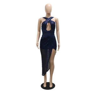 Detail of dark blue sequined party dress featuring criss-cross neck and high side slit