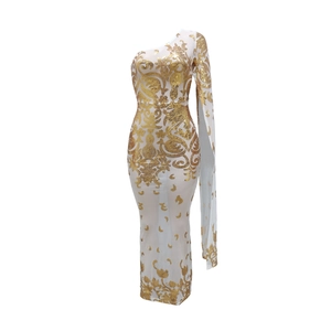 Detail of white mesh dress with gold sequins floral patterns and one shoulder sleeve