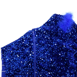 Detail of royal blue sequins and ostrich feather trim with hidden zipper on the shoulder
