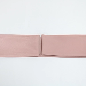 Detail of dust pink fabric belt featuring precise stitching for a stylish robe accessory