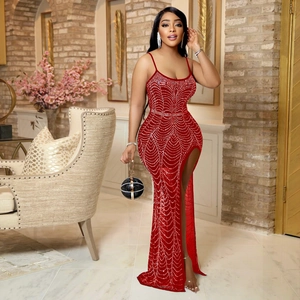 Detail of red halter dress with shimmering rhinestones and high side slit evening style