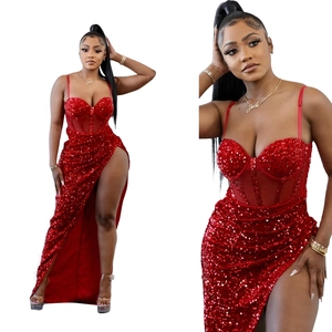 Detailed view of red sequin evening dress with high slit and sheer mesh bodice details