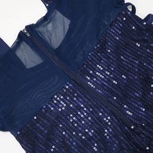 Detail of navy sequins and mesh fabric on a cocktail dress with an invisible zipper