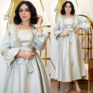 Elegant mint green satin maxi dress with gold embroidery and lantern sleeves