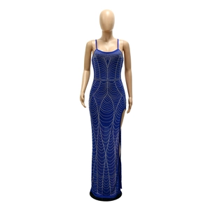 Detail of blue rhinestone evening dress featuring high side slit and wave patterns