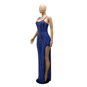 Detail view of sapphire blue dress with silver rhinestones and sexy high side slit