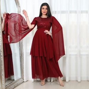 Elegant ruby red sequin evening gown with cape sleeves and waist belt for formal occasions