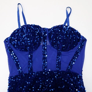 Macro detail of navy blue sequins and mesh fabric on a sexy party evening dress
