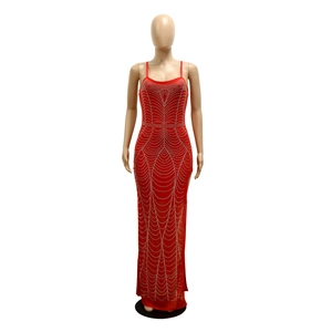 Detail of red sexy evening dress with sparkling rhinestones and elegant slit design