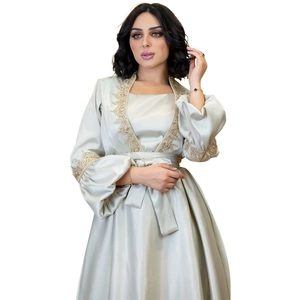 Elegant champagne satin maxi dress with lantern sleeves and intricate gold embroidery details