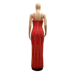 Detailed back view of a sexy red backless dress with glittering rhinestones and high slit