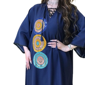 Detailed sequin embroidery on V-neck kaftan with tassel ties and loose drape