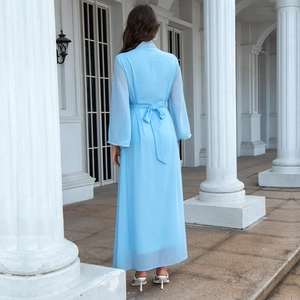 Detail of light blue chiffon kaftan with back waist bow and elegant rhinestone neckline