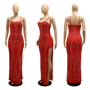 Detail of red mesh evening dress with wave rhinestone patterns and high side slit