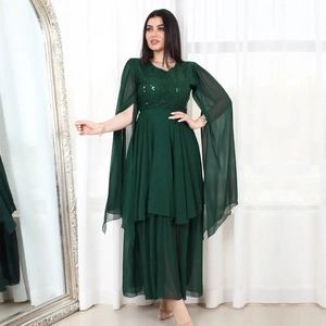 Detail of dark green sequin bodice and long split-sleeve chiffon evening gown with belt