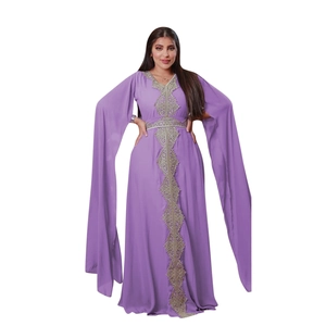 Detail of purple kaftan dress with gold embroidery and split long sleeves