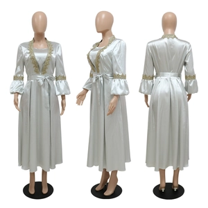 Three-view detail of silver blue satin kaftan with gold lace trim and lantern sleeves