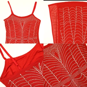 Detail of red rhinestone dress with sparkling silver geometric pattern and straps