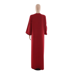 Rear view of long red sequins dress with detailed black stitching on sleeve cuffs