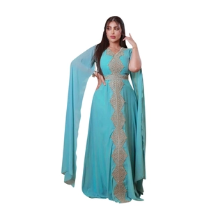 Detailed golden embroidery on light blue chiffon evening kaftan gown with long sleeves