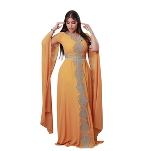 Detail of silver embroidery on bright orange V-neck chiffon kaftan with split sleeves