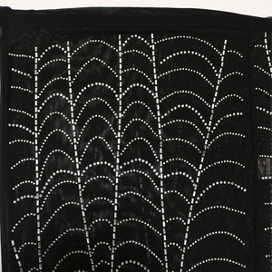 Detailed macro view of black mesh fabric with sparkling silver rhinestone wave patterns