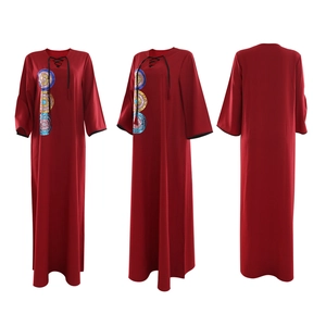 Close-up of red sequin embroidery and lace-up V-neck detail on the loose kaftan dress