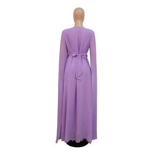 Back view of a purple chiffon evening dress with bow belt and floor-length cape sleeves