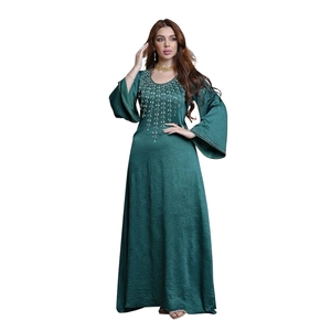 Elegant emerald green kaftan dress with gold embroidery and long flared sleeves