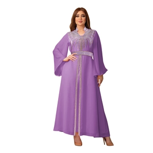 Detailed view of silver hot-fix rhinestones on a purple chiffon kaftan evening dress