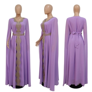 Detailed view of lavender chiffon maxi dress featuring golden embroidery and cape sleeves