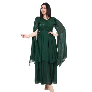Detail of dark green sequined bodice and flowing chiffon cape sleeves on evening gown