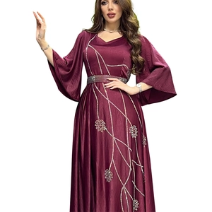 Detail of burgundy evening gown showing V-neck and silver sequin leaf embroidery