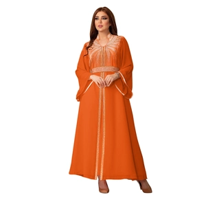 Close-up of sparkling rhinestones and sequins on this elegant orange Chiffon Kaftan dress