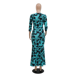Detailed back view of a slim-fit cyan fishtail dress with bold black floral print