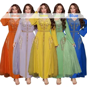 Detail of five-color kaftan dresses featuring golden embroidery and rhinestone embellishments