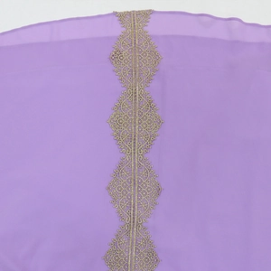 Close-up of golden lace embroidery on purple pearl chiffon evening dress with details