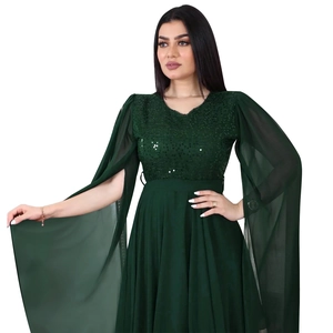 Detail of dark green evening dress with sequin embroidery and slit chiffon cape sleeves