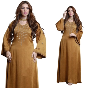 Detailed embroidery and beads on V-neckline of golden brown long modest kaftan dress