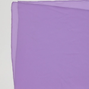 Detailed macro view of the light purple pearl chiffon fabric with fine stitching edges