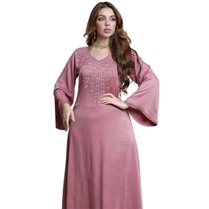 Detail of V-neckline with silver bead embroidery on dusty rose long kaftan dress
