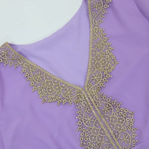 Close-up of the deep V-neckline with intricate golden lace embroidery on purple chiffon