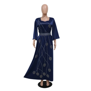 Detail of navy satin dress showing leaf embroidery and silver rhinestone belt decoration