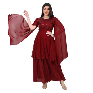 Detailed view of burgundy sequined bodice and flowing slit chiffon sleeves on evening dress