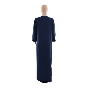Rear view of a navy blue sequin embroidery loose maxi dress showing its full-length drape