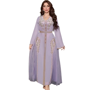 Detail of light purple kaftan dress featuring gold embroidery and sequin embellishments