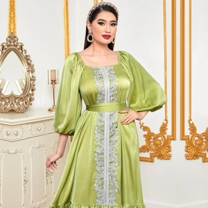 Elegant green satin kaftan dress with puff sleeves and silver embroidery detail