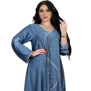 Detailed embroidery on a navy blue silk abaya featuring elegant silver sequins