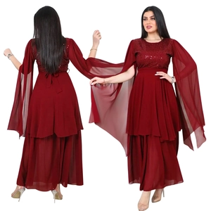 Detail of burgundy sequin evening dress featuring elegant cape sleeves and tiered chiffon skirt