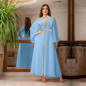 Detail view of light blue chiffon kaftan dress with sparkling silver rhinestones